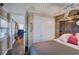 Bright bedroom offers closet space, and a doorway to a living room with water views at 24 Allatoona Landing Rd #29, Cartersville, GA 30121