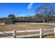 View of boat storage facility, featuring multiple covered slips, and surrounded by a white fence at 24 Allatoona Landing Rd #29, Cartersville, GA 30121