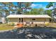 Cozy one-story home with a metal roof, handicap ramp, and well-maintained landscaping at 24 Allatoona Landing Rd #29, Cartersville, GA 30121