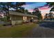 Charming one-story home with a metal roof at dusk and beautiful lake view at 24 Allatoona Landing Rd #29, Cartersville, GA 30121