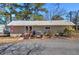 Quaint home with metal roof, accessible ramp, and well-maintained landscaping for welcoming curb appeal at 24 Allatoona Landing Rd #29, Cartersville, GA 30121