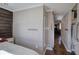 Hallway with wood accent wall, bedroom, and doorway to a hall with laundry area at 24 Allatoona Landing Rd #29, Cartersville, GA 30121
