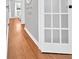 Hallway boasts shiny hardwood floors and a frosted-glass door leading to another room at 24 Allatoona Landing Rd #29, Cartersville, GA 30121