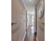 Hallway with accessible handrails, lighting, and wood-look floors at 24 Allatoona Landing Rd #29, Cartersville, GA 30121