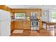 Functional kitchen features stainless steel appliances, ample wood cabinets, and view to the backyard at 24 Allatoona Landing Rd #29, Cartersville, GA 30121