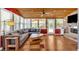 Open concept living room with wood floors, comfortable seating, fireplace, and great backyard views at 24 Allatoona Landing Rd #29, Cartersville, GA 30121