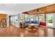 Open living room with wood ceiling and floors, large windows, and comfortable seating at 24 Allatoona Landing Rd #29, Cartersville, GA 30121