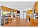 Open-concept living room and kitchen with hardwood floors, stone fireplace, and stainless steel appliances at 24 Allatoona Landing Rd #29, Cartersville, GA 30121