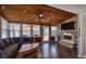 Comfortable sunroom with a stone fireplace and many windows, creating a warm ambiance at 24 Allatoona Landing Rd #29, Cartersville, GA 30121