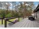 Spacious back deck with outdoor seating and a view of the lush backyard at 3473 Regalwoods Dr, Atlanta, GA 30340