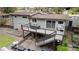 Aerial shot of a home's backyard, featuring a deck, patio, and landscaped yard at 3473 Regalwoods Dr, Atlanta, GA 30340