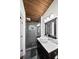 Modern bathroom with beautiful pebble stone shower floor, white marble countertop, and frameless glass shower at 3473 Regalwoods Dr, Atlanta, GA 30340