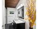 This bathroom features a modern vanity, vessel sink, frameless glass shower with pebble stone floor and stylish decor at 3473 Regalwoods Dr, Atlanta, GA 30340