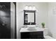 Modern bathroom with a vessel sink, and a frameless glass shower with grey tile and pebble stone floor at 3473 Regalwoods Dr, Atlanta, GA 30340