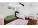 Charming bedroom with stylish furnishings, including daybed, rug, and vanity at 3473 Regalwoods Dr, Atlanta, GA 30340