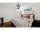 Cozy bedroom with wood floors, a ceiling fan, and window providing natural light at 3473 Regalwoods Dr, Atlanta, GA 30340