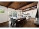 Open concept dining area with hardwood floors, stylish light fixture, and modern kitchen at 3473 Regalwoods Dr, Atlanta, GA 30340