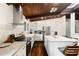 Bright kitchen with stainless steel appliances, white cabinetry, and wood floors at 3473 Regalwoods Dr, Atlanta, GA 30340