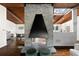 Open concept living room with fireplace, hardwood floors, vaulted ceilings, and view to kitchen at 3473 Regalwoods Dr, Atlanta, GA 30340