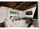 Stylish living room with hardwood floors, large window, modern furniture, and views of the front yard at 3473 Regalwoods Dr, Atlanta, GA 30340