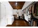 A walk-in closet with hardwood floors, custom shelving and dresser, and natural light from the window at 3473 Regalwoods Dr, Atlanta, GA 30340