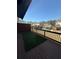 Outdoor patio with green turf and views of the community pool and other townhomes at 4121 Townsend Ln, Atlanta, GA 30346