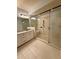 Modern bathroom featuring a spacious glass shower, sleek fixtures, and granite vanity at 4121 Townsend Ln, Atlanta, GA 30346