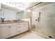 Modern bathroom with walk-in glass shower and double vanity with granite countertops at 4121 Townsend Ln, Atlanta, GA 30346