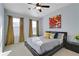 Comfortable bedroom with vaulted ceiling and large windows to let in natural light at 4121 Townsend Ln, Atlanta, GA 30346