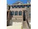Attractive brick townhome with a private garage, a welcoming entrance, and classic black shutters at 4121 Townsend Ln, Atlanta, GA 30346