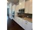 Well-equipped kitchen with granite counters, stainless appliances, and stylish white cabinetry at 4121 Townsend Ln, Atlanta, GA 30346