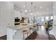 Modern kitchen with stainless steel appliances, granite countertops, and a breakfast bar at 4121 Townsend Ln, Atlanta, GA 30346