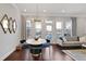 Cozy living room and dining area with hardwood floors and modern lighting fixture at 4121 Townsend Ln, Atlanta, GA 30346