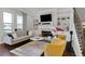 Comfortable living room with fireplace, built-in shelves, and plush seating at 4121 Townsend Ln, Atlanta, GA 30346