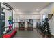 A recreation room with built-in cabinets perfect for an office and gym equipment at 4121 Townsend Ln, Atlanta, GA 30346