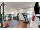 Spacious recreation room with built-in cabinetry, home gym and an exercise area at 4121 Townsend Ln, Atlanta, GA 30346