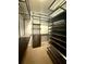 Walk-in closet with custom shelving, drawers, and ample storage space at 4121 Townsend Ln, Atlanta, GA 30346