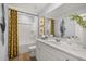 Bathroom featuring a tub shower combo, vanity, and plant accents at 604 Blue Sky Blvd, Acworth, GA 30102