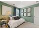 Stylish bedroom showcasing verdant walls, neutral carpet, and a well-lit space at 604 Blue Sky Blvd, Acworth, GA 30102