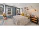 Stylish bedroom with patterned wallpaper, a comfortable bed, and lots of natural light at 604 Blue Sky Blvd, Acworth, GA 30102