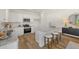 Modern kitchen featuring white cabinets, stainless steel appliances, granite countertops and a center island with seating at 604 Blue Sky Blvd, Acworth, GA 30102