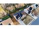Aerial view of suburban home with mature trees and landscaping in a residential neighborhood at 4033 Roxberry Hill Ln, Buford, GA 30518
