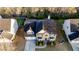 Aerial view of a well-maintained house with a two-car garage, a manicured lawn, and mature trees at 4033 Roxberry Hill Ln, Buford, GA 30518