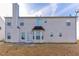 Back of home with patio and siding at 4033 Roxberry Hill Ln, Buford, GA 30518