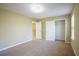 Empty bedroom featuring carpet, a closet, and access to other areas of the home at 4033 Roxberry Hill Ln, Buford, GA 30518