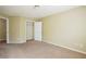 Bedroom featuring plush carpet, neutral paint, and closet at 4033 Roxberry Hill Ln, Buford, GA 30518