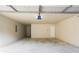 Spacious garage with neutral walls and concrete floors at 4033 Roxberry Hill Ln, Buford, GA 30518
