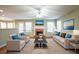 Staged living room features a fireplace, modern furnishings, and bright, airy atmosphere at 4033 Roxberry Hill Ln, Buford, GA 30518