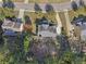 An aerial view of a house, showcasing its landscaping, proximity to the road, and surrounding neighborhood at 4950 Luke Dr, Cumming, GA 30040