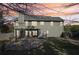 Back exterior of home with patio and pergola with mature trees at 4950 Luke Dr, Cumming, GA 30040